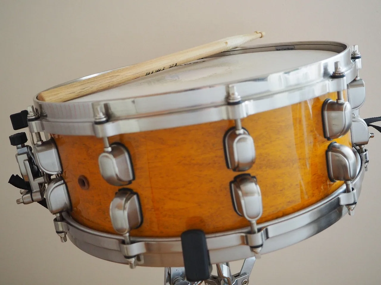 Wooden snare drum with drumsticks