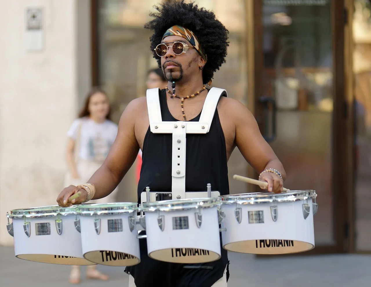 Street drummer with multiple drums