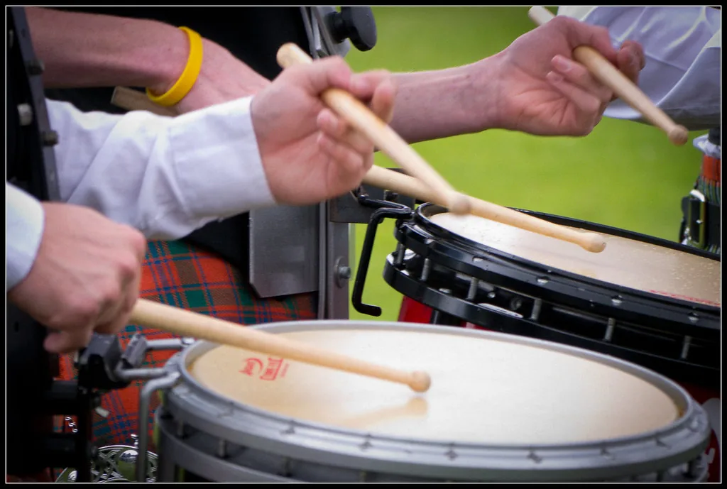 Drummers playing drums outdoors Drummers playing drums outdoors