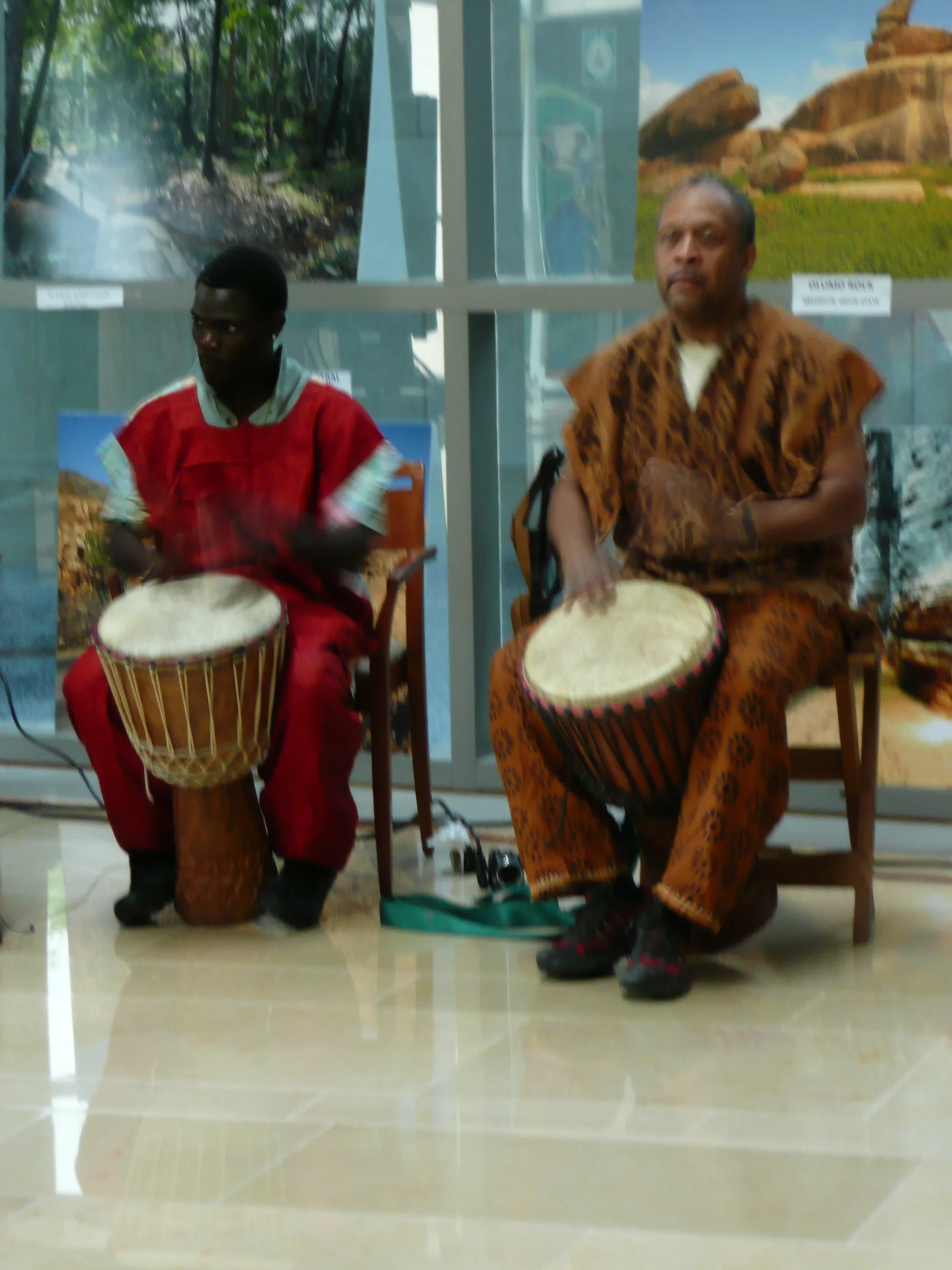 Musicians playing the djembe