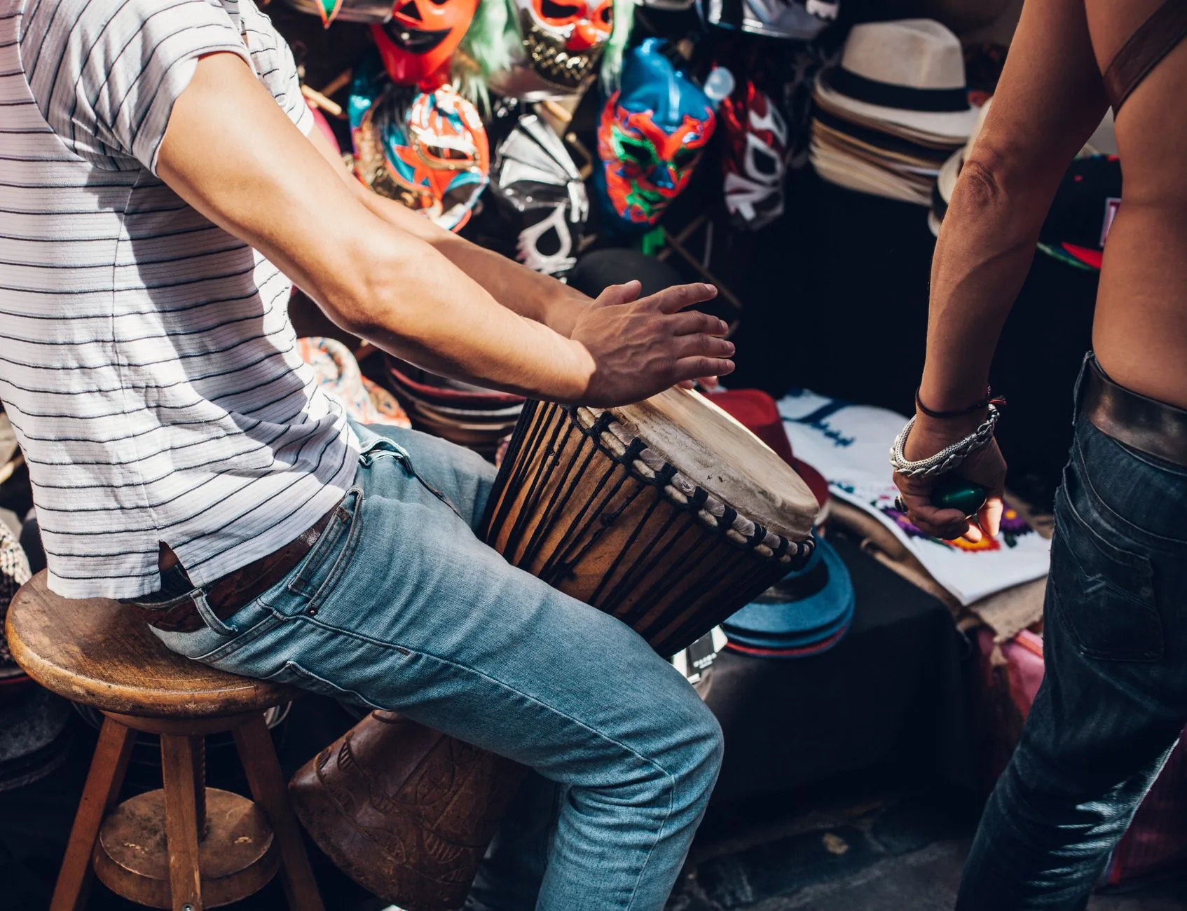 Musician Playing a Djembe by Hand Musician playing a djembe by hand
